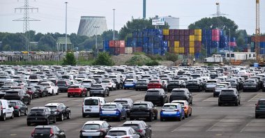 Cars stand ready for export at a parking lot of the Duisburg harbour, western Germany, July 14, 2025. (AFP Photo)