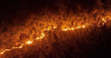 An aerial view shows the forest fire between the Orhaneli and Harmancık districts being battled by crews through the night, Bursa, Türkiye, July 29, 2025. (AA Photo)