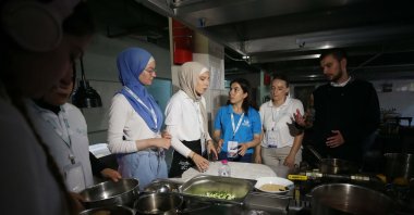 International students prepare traditional dishes from their home countries during a gastronomy workshop at Çanakkale March 18 University, Türkiye, July 29, 2025. (AA Photo)