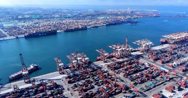 Containers and ships are seen at the port in Qingdao, China’s eastern Shandong province, July 28, 2025. (AFP Photo)