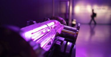 A display shows the ultraviolet light technology used to treat wastewater as a group tours the NEWater visitor center in Singapore, Tuesday, July 18, 2023. (AP File Photo)