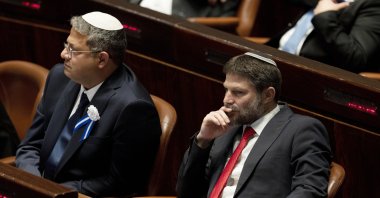 Far-right Israeli lawmakers Itamar Ben Gvir, center, and Bezalel Smotrich, right, attend the swearing-in ceremony for Israel's parliament, at the Knesset, in Jerusalem, Nov. 15, 2022. (AP File Photo)