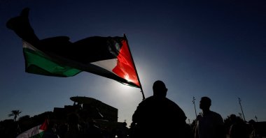 A demonstrator holds a Palestinian flag during an "Act NOW against Genocide in Gaza" protest in Valletta, Malta, July 29, 2025. (Reuters Photo)