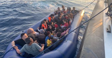 Irregular migrants being taken to a Turkish coast guard boat off the coast of Ayvacık, Çanakkale, western Türkiye, July 25, 2025. (AA Photo)