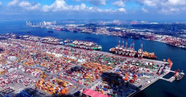 Containers and ships are seen at the port in Qingdao, Shandong province, eastern China, July 25, 2025. (AFP Photo)