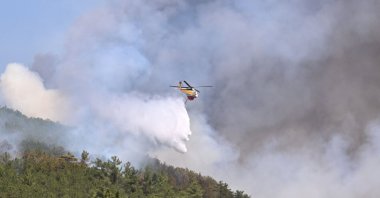 Aerial and ground crews continue efforts to control the forest fire on its fourth day between Orhaneli and Harmancık districts, Bursa, Türkiye, July 29, 2025. (AA Photo)