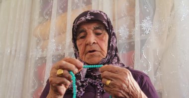 Ayşe Uğur, 101, with her prayer beads at her home, Gaziantep, Türkiye, July 30, 2025. (IHA Photo)