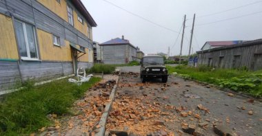 A car drives past a building damaged in the mega earthquake in Kamchatka, Far East Russia, July 30, 2025. (AA Photo)