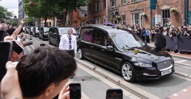 A hearse carries the body of the late Black Sabbath frontman Ozzy Osbourne during his tribute parade, Birmingham, U.S., July 30, 2025. (AA Photo)