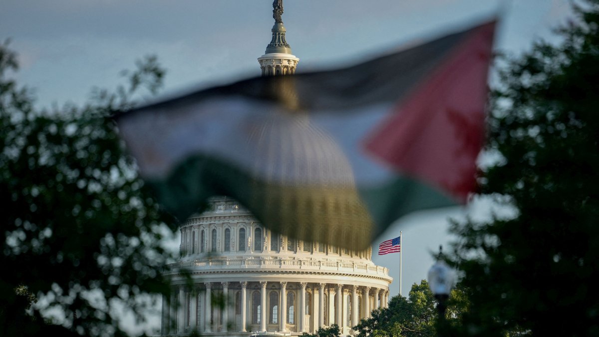 A Palestinian flag partially obscures the dome of the U.S. Capitol building as demonstrators rally during a protest in Washington, D.C., U.S., July 28, 2025. (Reuters Photo)