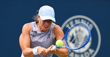 Iga Swiatek returns the ball to Hanyu Guo in second round play at IGA Stadium, Montreal, Canada, July 30, 2025. (Reuters Photo)