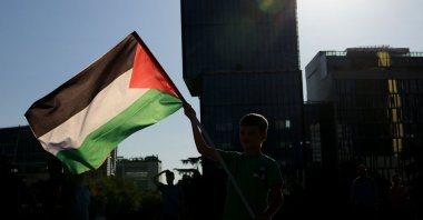 A boy waves a Palestinian flag during a demonstration to support the population of Gaza, Tirana, Albania, July 23, 2025. (AFP Photo)