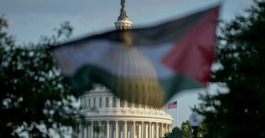 A Palestinian flag partially obscures the dome of the U.S. Capitol building as demonstrators rally during a protest in Washington, D.C., U.S., July 28, 2025. (Reuters Photo)