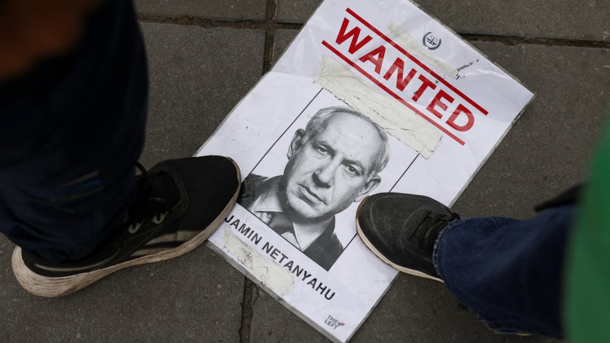 People step on a piece of paper with the image of Israeli Prime Minister Benjamin Netanyahu, during a protest in support of Palestine, Paris, France, July 31, 2025. (Reuters Photo)