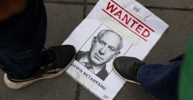 People step on a piece of paper with the image of Israeli Prime Minister Benjamin Netanyahu, during a protest in support of Palestine, Paris, France, July 31, 2025. (Reuters Photo)
