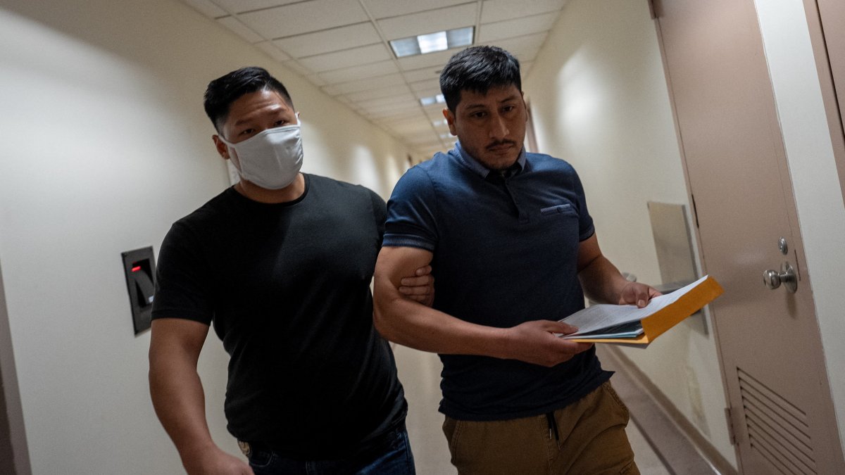 A migrant is detained by a federal immigration officer at a U.S. immigration court in Manhattan, in New York City, U.S., August 1, 2025. (Reuters Photo)