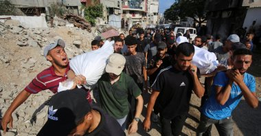 People carry bodies of Palestinians, who were killed by Israeli fire while trying to receive aid on Friday, according to medics, at Al-Shifa Hospital, in Gaza City, August 2, 2025. (Reuters Photo)