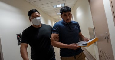 A migrant is detained by a federal immigration officer at a U.S. immigration court in Manhattan, in New York City, U.S., August 1, 2025. (Reuters Photo)