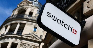 A logo of Swiss watchmaker Swatch Group is pictured on a store, Paris, France, Aug. 3, 2025. (Reuters Photo)