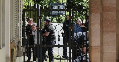 Demonstrators from Animal Rebellion are arrested by the police after entering the grounds of the Nuremberg Zoo in Nuremberg, Germany, Tuesday, July 29, 2025. (Daniel Loeb/dpa via AP)