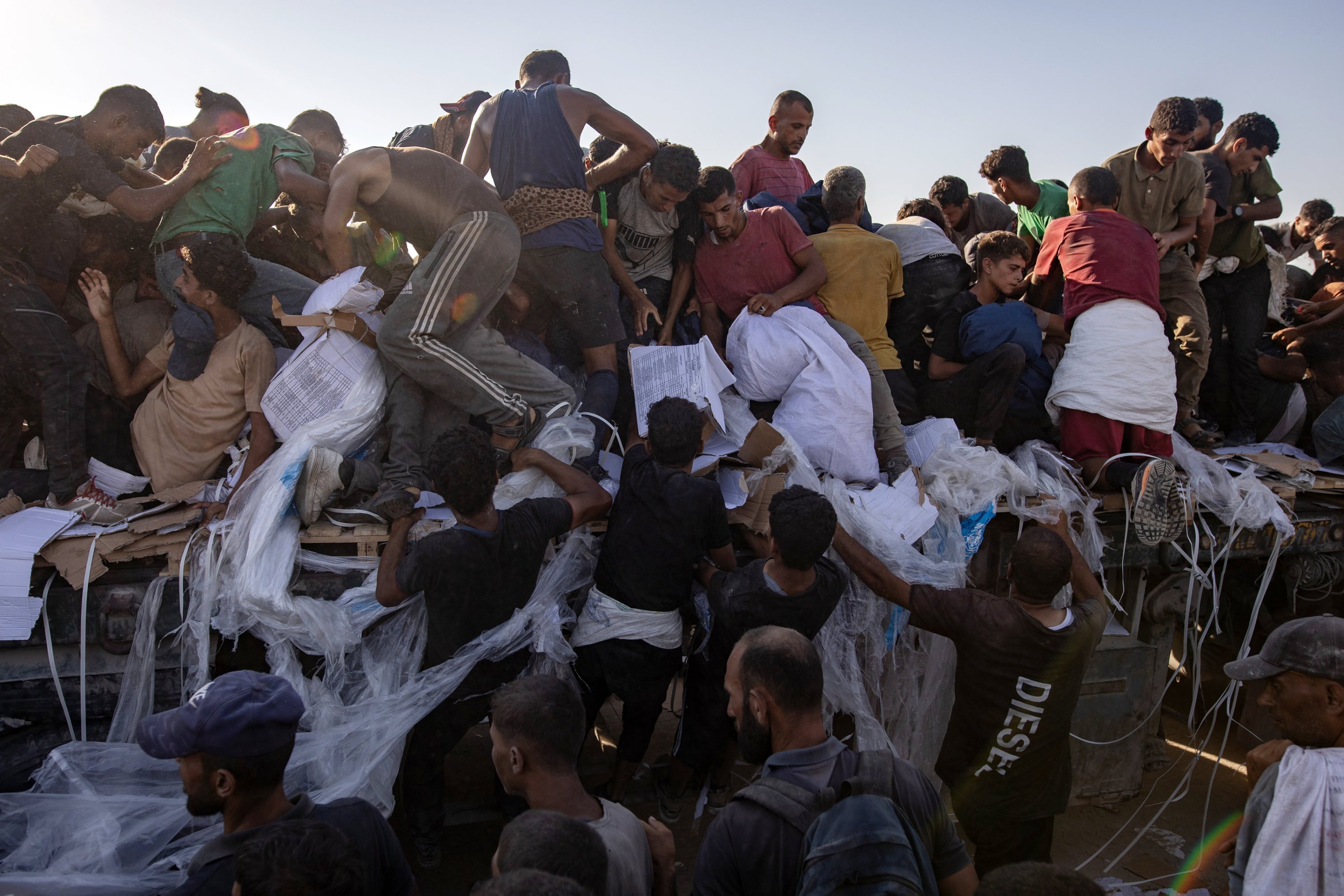 Gaza aid scramble turns deadly as Israeli fire, famine fears collide