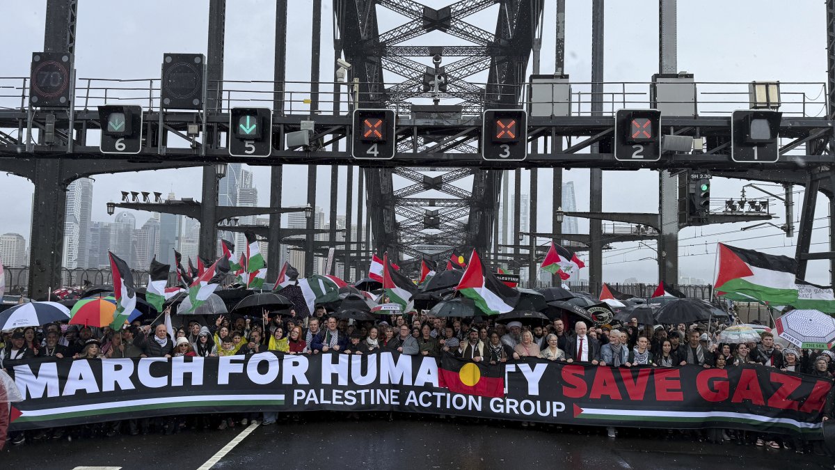 Thousands of protesters walk across the Sydney Harbour Bridge during the Palestine Action Group&#039;s March for Humanity, Sydney, Australia, Aug. 3, 2025. (AP Photo)