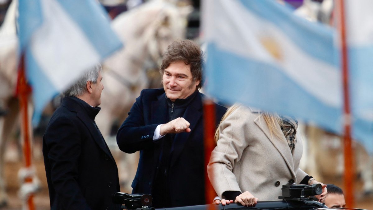 Argentina&#039;s President Javier Milei (C), his sister, Secretary General of the Presidency Karina Milei, and Economy Minister Luis Caputo arrive for the Argentine Rural Society&#039;s expo, Buenos Aires, Argentina, July 26, 2025. (AFP Photo)