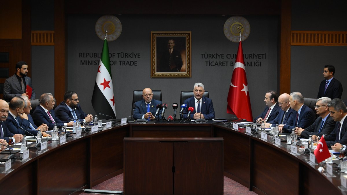 Trade Minister Ömer Bolat (C-R) and Syrian Economy and Industry Minister Mohammad Nidal al-Shaar (C-L) attend a signing ceremony of the founding protocol of the Türkiye-Syria Joint Economic and Trade Committee (JETCO), Ankara, Türkiye, Aug. 5, 2025. (AA Photo)