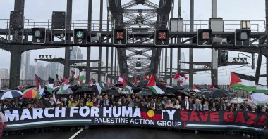 Thousands of protesters walk across the Sydney Harbour Bridge during the Palestine Action Group's March for Humanity, Sydney, Australia, Aug. 3, 2025. (AP Photo)