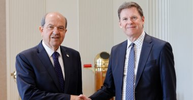 Turkish Republic of Northern Cyprus (TRNC) President Ersin Tatar (L) meets U.N. secretary-general’s special representative on Cyprus and head of the U.N. Peacekeeping Force, Colin Stewart, for a farewell visit, Lefkoşa (Nicosia), TRNC, Aug. 5, 2025. (AA Photo)