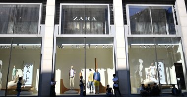 Customers queue to enter the clothing retailer Zara on Oxford Street, London, U.K., June 16, 2020. (AFP Photo)
