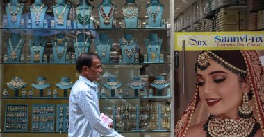 A man walks past the jewelry shop in the Zaveri Bazaar (Jewellery Market) area, Mumbai, India, July 31, 2025.  (EPA Photo)