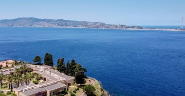 A general aerial view shows the Sicilian coast toward Cape Torre Faro, over the Strait of Messina, taken from the outskirts of the town of Scilla, Calabria, southern Italy, July 7, 2020. (AFP Photo)