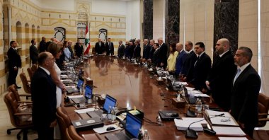 Lebanese President Joseph Aoun, Prime Minister Nawaf Salam and members of the cabinet stand for a minute of silence to remember the fifth anniversary of the Beirut port explosion, during a cabinet meeting to discuss efforts to bring all weapons in the country under the control of the state, at the Presidential Palace in Baabda, Lebanon Aug. 5, 2025. (Reuters Photo)
