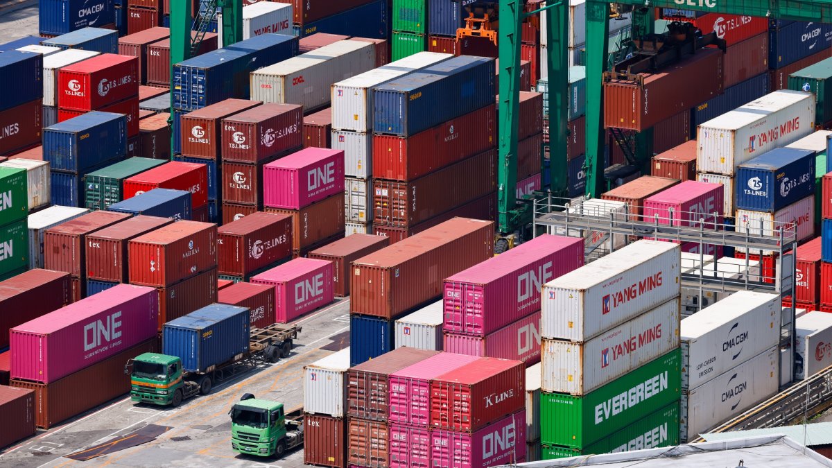 Shipping containers are being moved at the port in Keelung City, Taiwan, Aug. 7, 2025. (EPA Photo)
