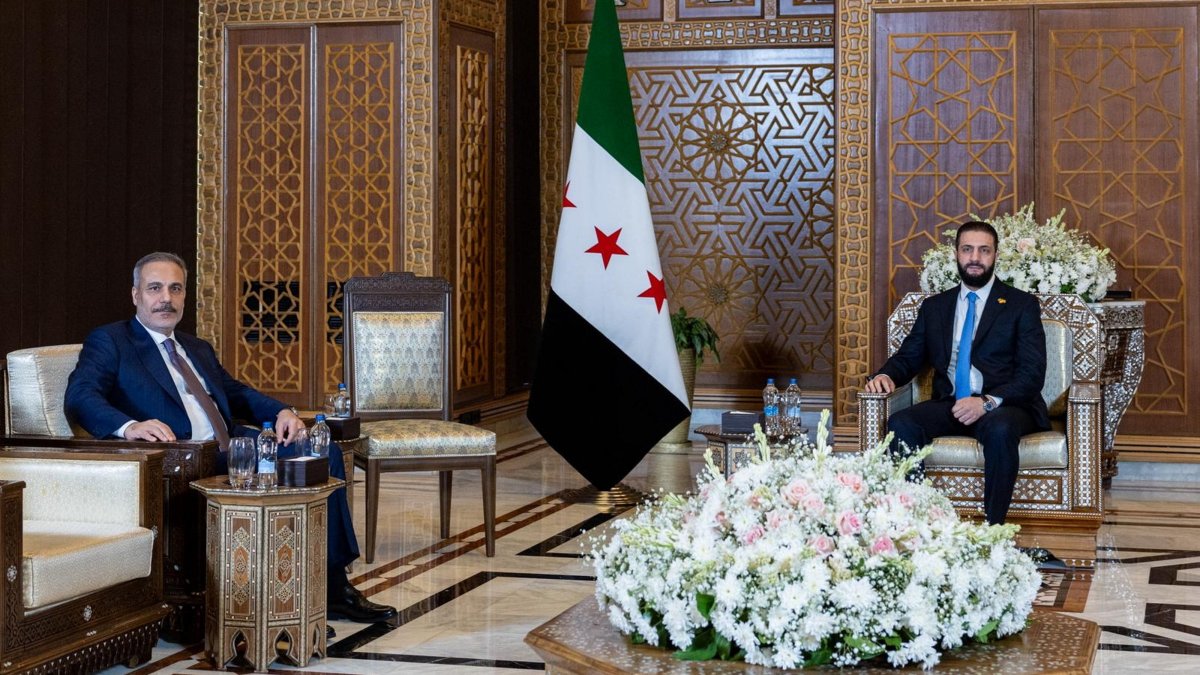 A handout photo made available by the Turkish Foreign Ministry Press Office shows Syrian interim President Ahmed al-Sharaa and Foreign Minister Hakan Fidan during their meeting in Damascus, Syria, Aug. 7, 2025. (EPA via Turkish Foreign Ministry)