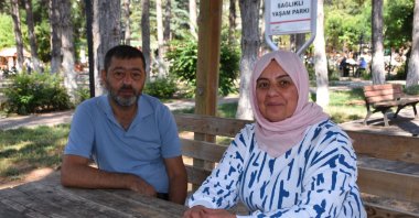 Keziban Oral and her husband Mehmet Oral pose during an interview at a park, Afyonkarahisar, western Türkiye, Aug. 5, 2025. (AA Photo)