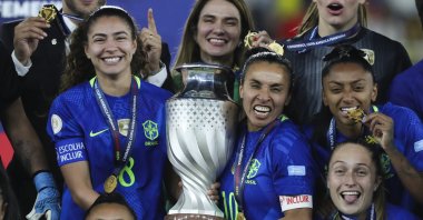 Angelina Alonso (L) and Marta of Brazil celebrate with teammates and the trophy after winning the Women&#039;s Copa America final match between Colombia and Brazil, Quito, Ecuador, Aug. 2, 2025. (EPA Photo)