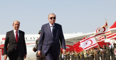 President Tayyip Erdoğan walks with Turkish Cypriot leader Ersin Tatar (L) upon his arrival at Ercan Airport in Lefkoşa (Nicosia), TRNC, July 20, 2025. (Reuters Photo)