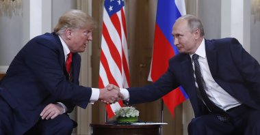 U.S. President Donald Trump (L) and Russian President Vladimir Putin shake hands at the beginning of a meeting at the Presidential Palace, Helsinki, Finland, July 16, 2018. (AP Photo)