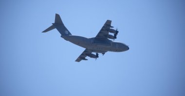 A military plane flies over the Nuseirat area in the central Gaza Strip, Palestine, Aug. 6, 2025. (AFP Photo)
