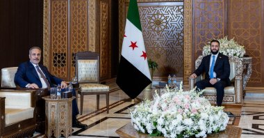A handout photo made available by the Turkish Foreign Ministry Press Office shows Syrian interim President Ahmed al-Sharaa and Foreign Minister Hakan Fidan during their meeting in Damascus, Syria, Aug. 7, 2025. (EPA via Turkish Foreign Ministry)