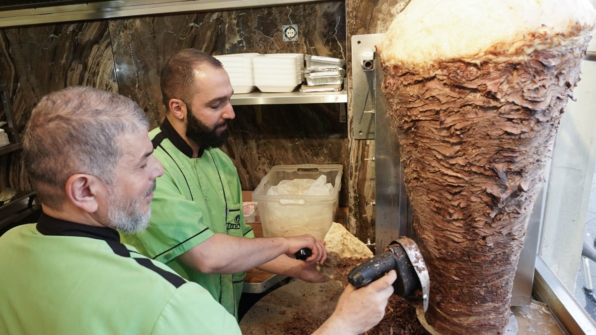 Workers prepare a kebab at the Imren Grill döner shop, in Berlin, Germany, March 19, 2022. (DPA File Photo)