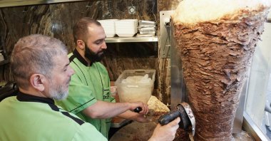 Workers prepare a kebab at the Imren Grill döner shop, in Berlin, Germany, March 19, 2022. (DPA File Photo)