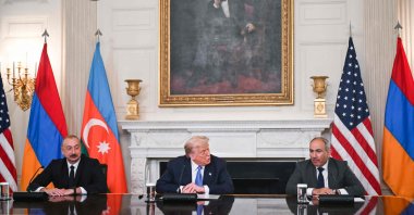 U.S. President Donald Trump participates in a trilateral signing with Azerbaijani President Ilham Aliyev (L) and Armenian Prime Minister Nikol Pashinyan (R) in the State Dining Room of the White House in Washington, D.C., Aug. 8, 2025. (AFP Photo)