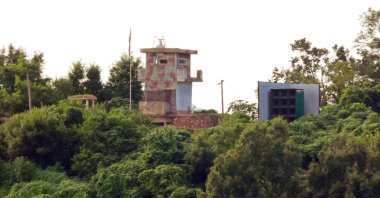A North Korean military guard post (L) and loudspeaker are seen from Paju, South Korea, near the border with North Korea, Aug. 9, 2025. (AP Photo)