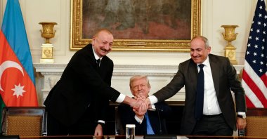 (L-R) Azerbaijan&#039;s President Ilham Aliyev, U.S. President Donald Trump and Armenia&#039;s Prime Minister Nikol Pashinyan join hands during a signing ceremony in the State Dining Room of the White House, Washington, U.S., Aug. 8, 2025. (EPA Photo)