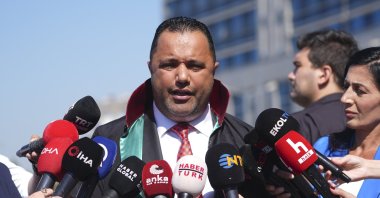 Rezan Epözdemir talks to reporters before a trial, Istanbul, Türkiye, July 17, 2025. (AA Photo)