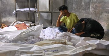Palestinians mourn over the shrouded bodies of people killed by Israel near Zikim, west of Beit Lahia, northern Gaza Strip, Palestine, Aug. 10, 2025. (AFP Photo)