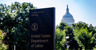 The U.S. Capitol is seen in the background as signage for the Department of Labor is seen, Washington, U.S., Aug. 4, 2025. (AFP Photo)